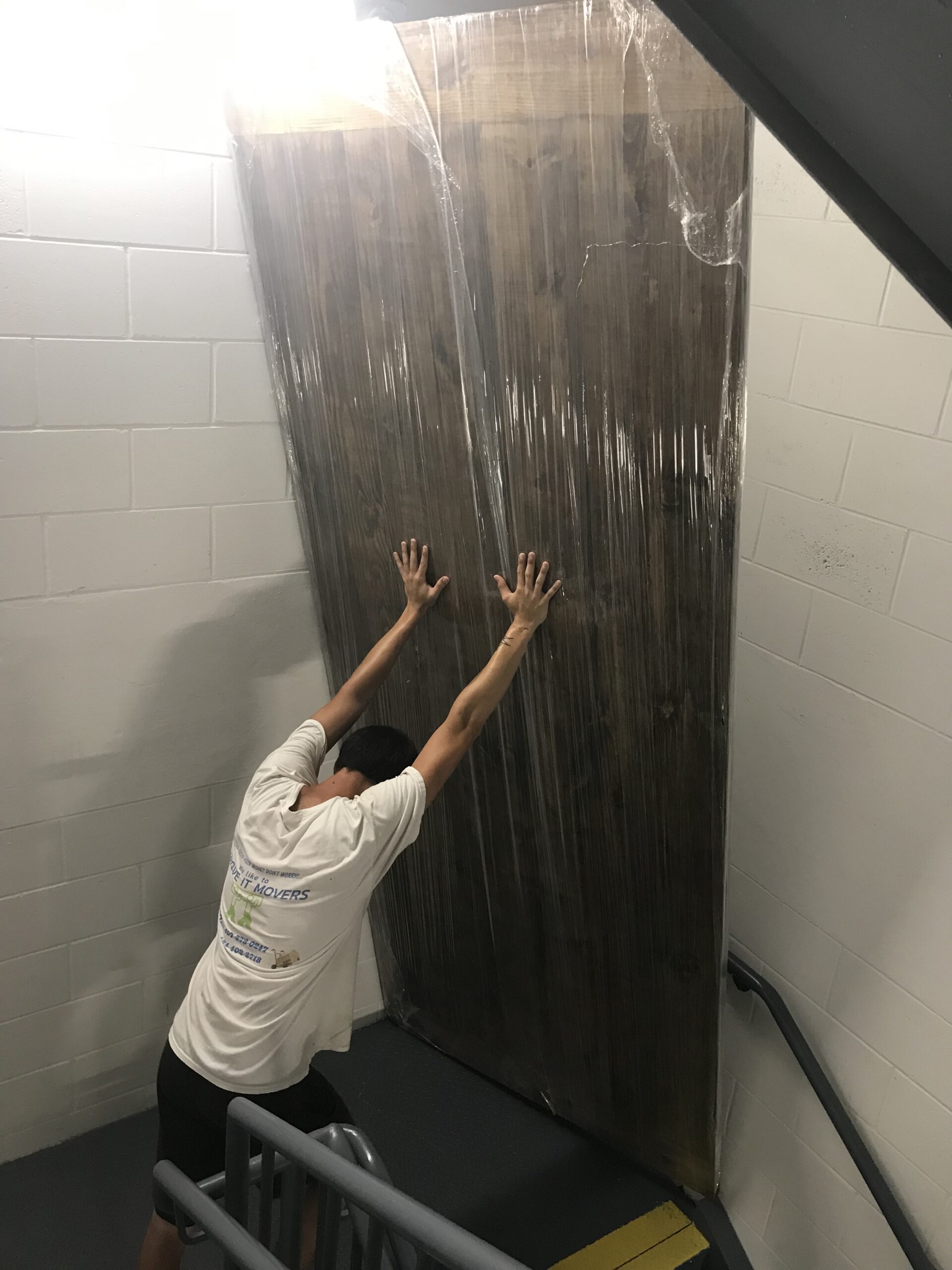 Movers handling oversized item